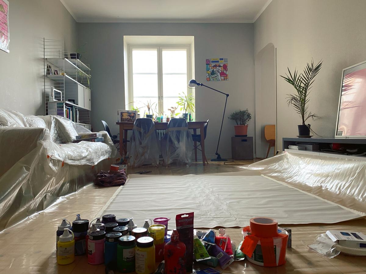 Apartment view with painting material and plastic protection on the floor