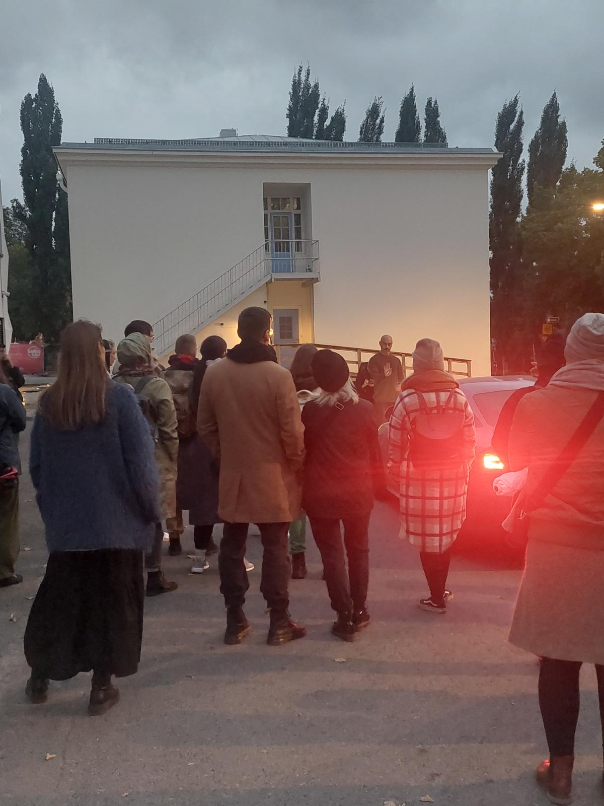 People gathered watching a performance