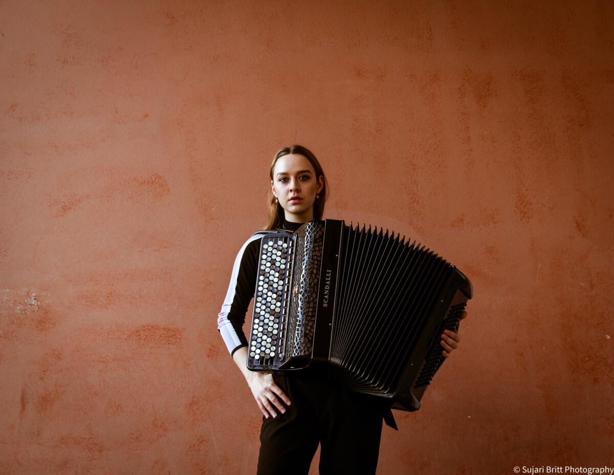 sabina with her big black acordian